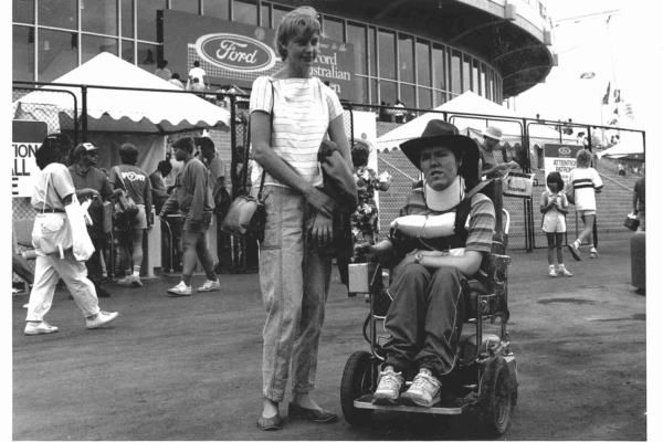 TWo people outside a stadium.