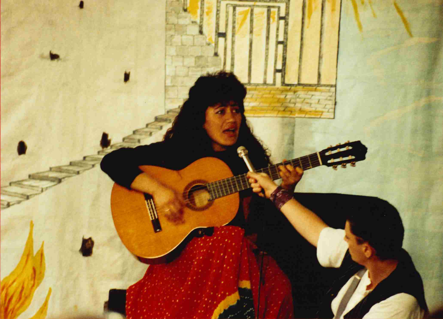 a woman playing a guitar