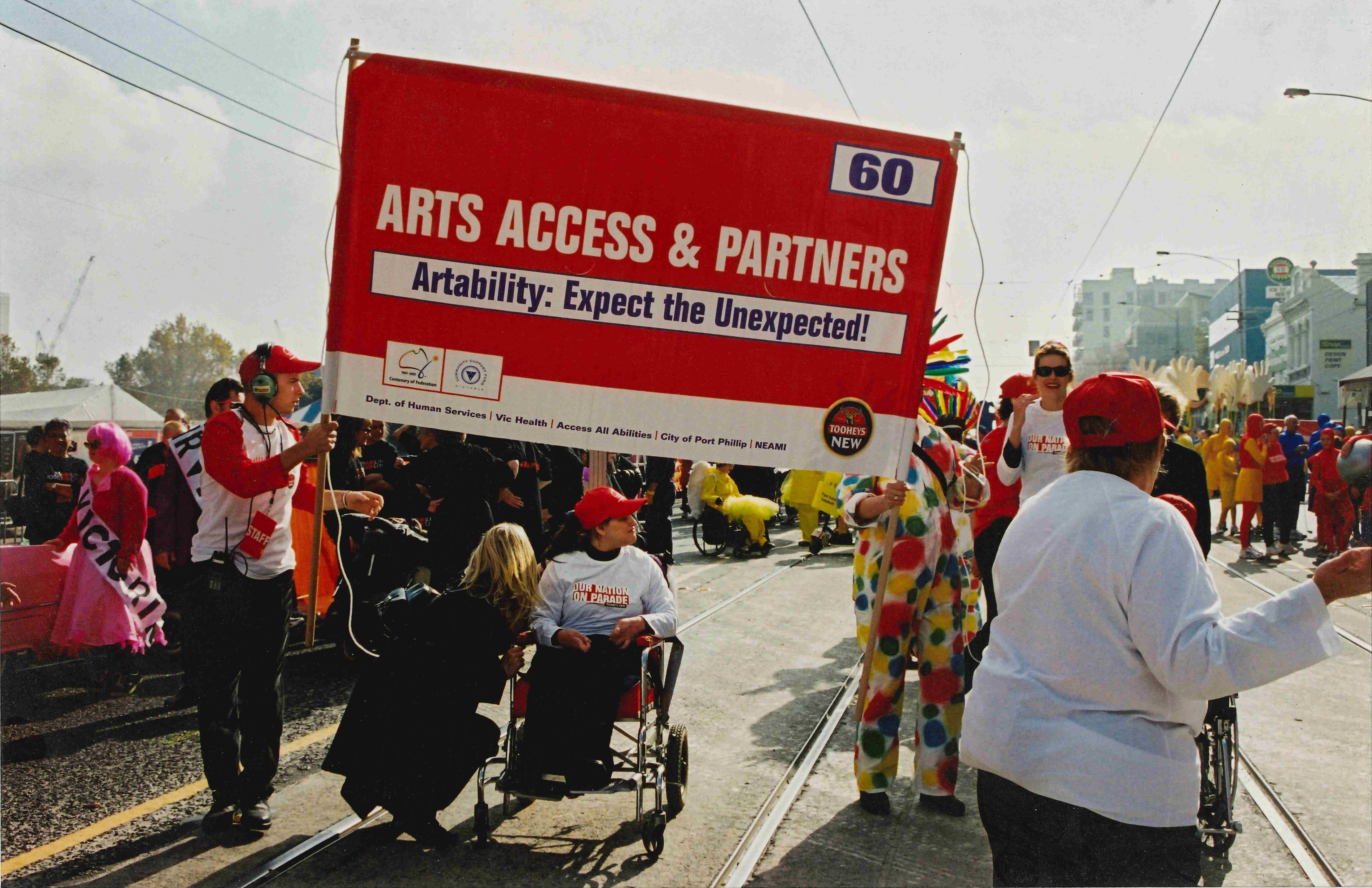 People holding up a sign saying 