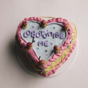 heart-shaped wooden trinket box in a foam clay cake decoden with the word ‘lobotomise me’ with beads and stars decoration