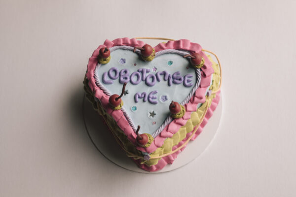 heart-shaped wooden trinket box in a foam clay cake decoden with the word ‘lobotomise me’ with beads and stars decoration