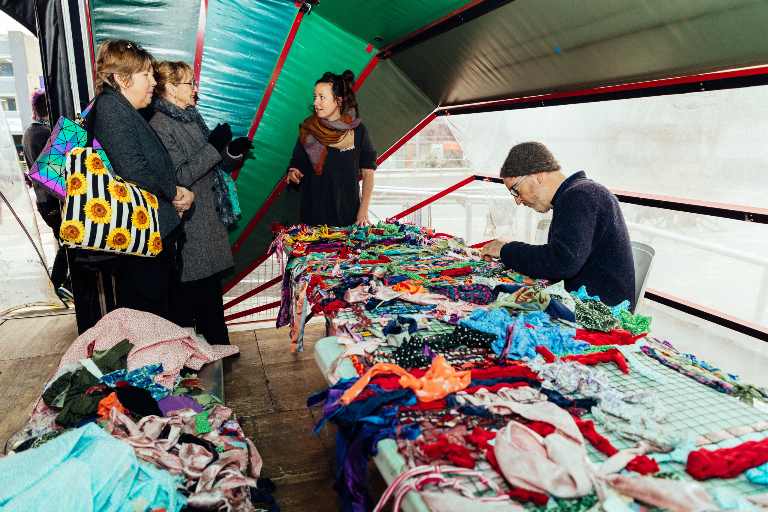 People inside the Nebula tent working on crafts.