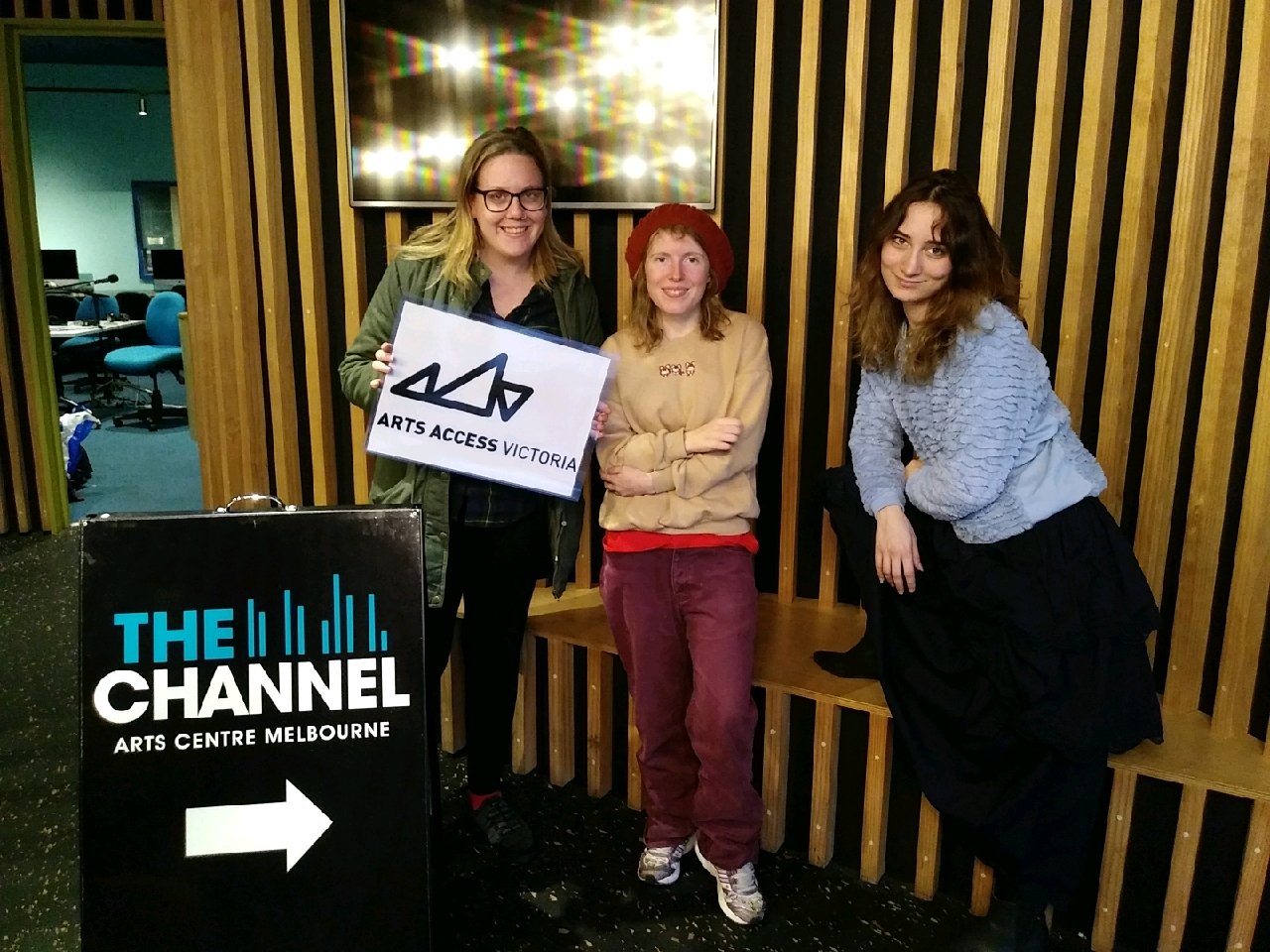 Three people standing inside the Channel at Arts Centre Melbourne.